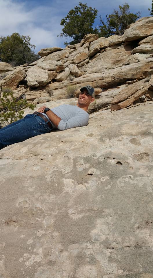 Man lying on rocks outdoors