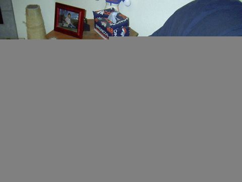 1988 Ford Bronco - A tissue box with "BRONCOS" text is visible on a shelf next to a framed photograph.
