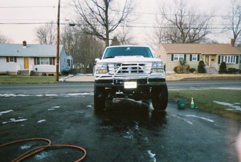 1996 Ford C-250 (Centurion Conversions) - This lifted truck appears to be a 1996 Ford C-250 Centurion Conversion, viewed from the front.