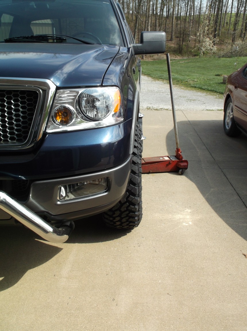 Blue 2005 Ford F-150 front quarter view with large tires
