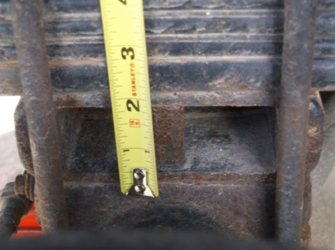2005 Ford F-150 - Measuring leaf spring thickness with a Stanley tape measure.