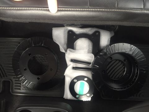 1982 Ford Bronco - New brake rotors and hardware are shown, ready for installation.
