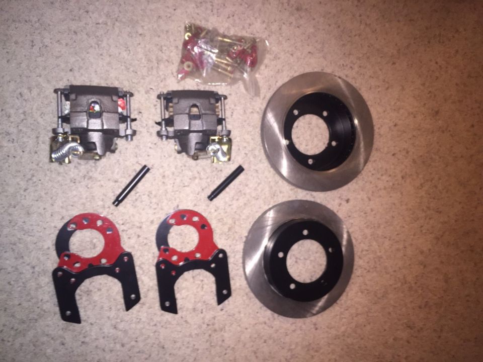 Pair of brake calipers, two rotors, and mounting hardware