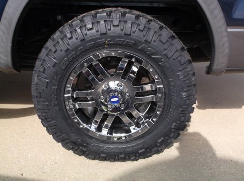 2005 Ford F-150 - Close-up of a chrome wheel and BFGoodrich All-Terrain T/A KO2 tire mounted on a truck.