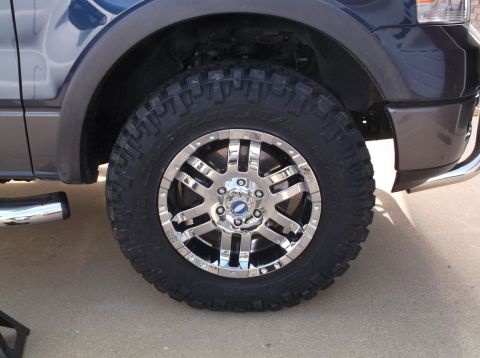 2005 Ford F-150 - Front wheel and tire assembly on a 2005 Ford F-150.