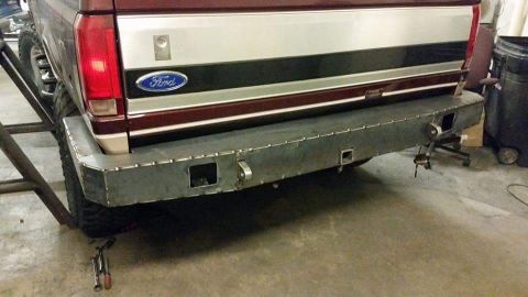 1996 Ford Bronco - The rear of a 1996 Ford Bronco features a custom-welded bumper with integrated tow hitch receivers.