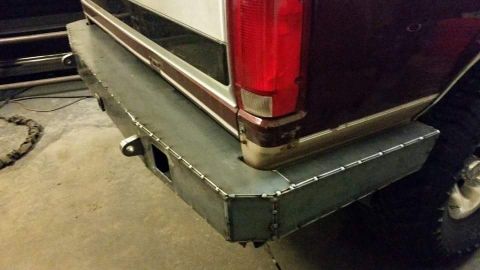 1996 Ford Bronco - Close-up of a custom-welded rear bumper on a vehicle, a tow hitch.
