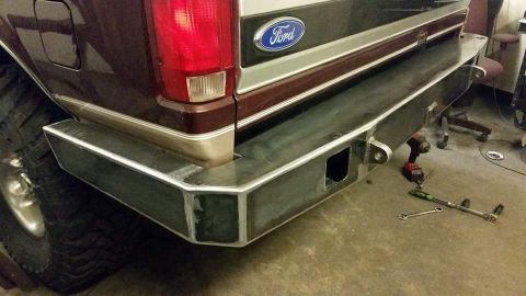 1996 Ford Bronco - Custom steel rear bumper installed on a Ford truck, showing the Ford emblem and taillight.