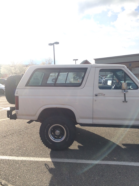 1981 Ford Bronco - This 1981 Ford Bronco is shown from the side, its iconic boxy shape and a rear-mounted spare tire.