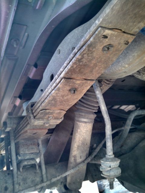 1995 Ford Bronco - Old Stuff: Original leaf springs lifted with Rough Country blocks, old Hecklethorn shocks