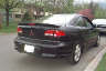1994 Ford Taurus - Rear view of a black car with a blurred license plate. The vehicle does not appear to be a 1994 Ford Taurus.