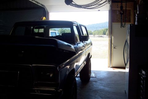 1978 Ford Bronco - 1978 Ford Bronco in a garage, with a second vehicle visible outside.