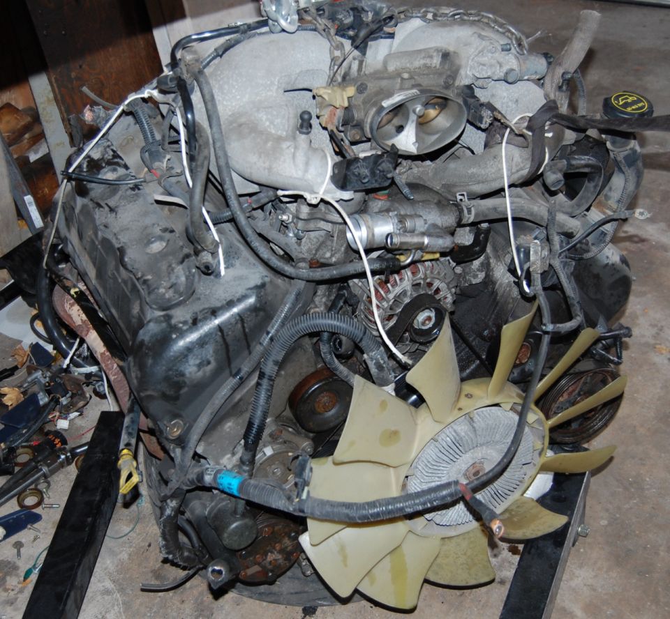 Engine assembly with fan and wiring harness. SuperMotors logo visible