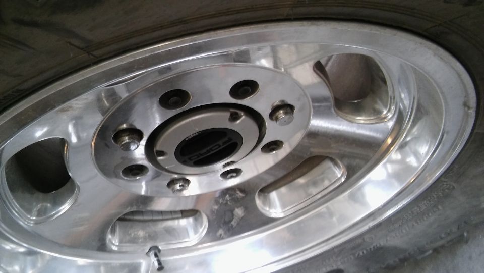 Close-up of a Ford Bronco wheel hub and tire.
