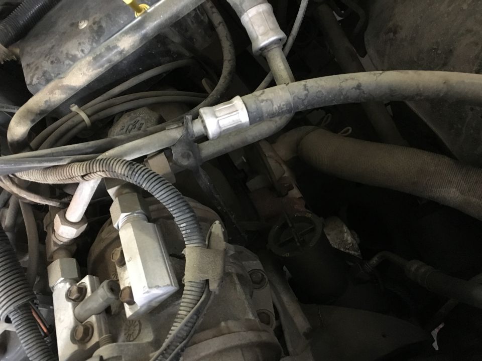 Engine bay with AC hoses and components