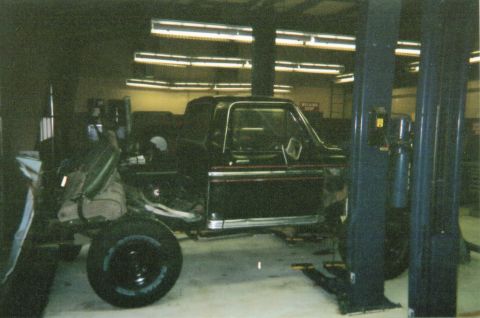 1978 Ford Bronco - This 1978 Ford Bronco is being worked on in a garage, with its doors open and interior exposed.