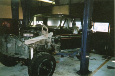 1978 Ford Bronco - This truck is in a garage with its front end removed for repairs or modifications.
