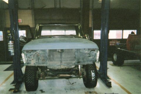1978 Ford Bronco - This vehicle is undergoing repairs or restoration in a workshop setting.