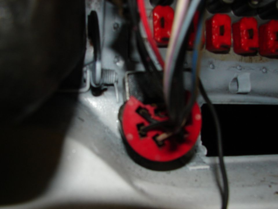 Red electrical connector with wires and fuse box
