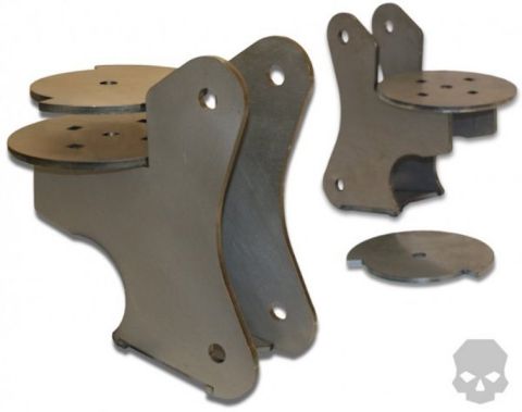 1981 Ford Bronco - A set of metal brackets and circular plates are shown against a white background. The parts appear to be for a vehicle modification.