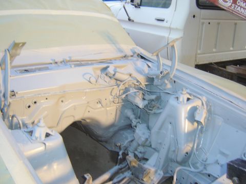 1971 Ford Ranchero - The engine bay of a classic vehicle, likely a Ford Ranchero, is shown with the hood open and the engine components and firewall painted in…