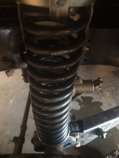 1996 Ford Bronco - Close-up view of a black coil spring suspension component, possibly from a 1996 Ford Bronco, with the "DEAVER" brand name visible on the sp…