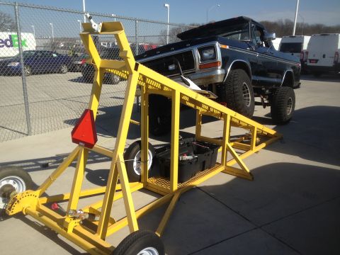 1979 Ford Bronco - A lifted 1979 Ford Bronco is parked on a yellow ramp system outdoors. The Bronco is black with large off-road tires and is positioned at an…
