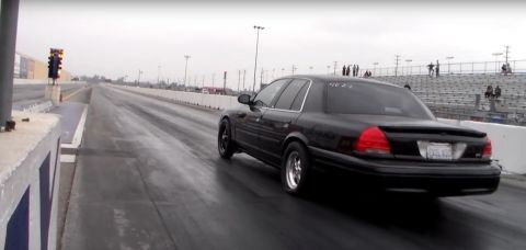 2003 Ford Crown Victoria - Photograph of a car at a drag strip, not a technical document.