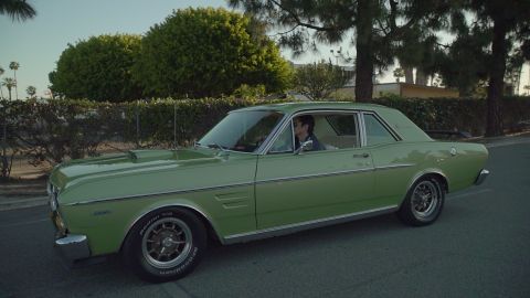 1993 Ford Taurus - This light green 1986 Ford sedan is seen from the front-three-quarter angle.