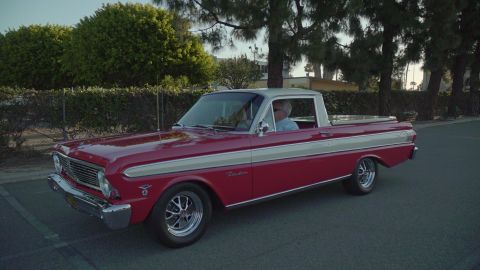 1993 Ford Taurus - A classic red pickup truck from the 1960s is parked outdoors during the day.