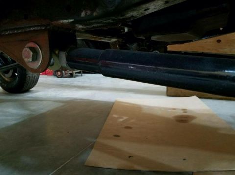 1979 Ford Bronco - Close-up view of vehicle suspension components, including a shock absorber and mounting hardware.