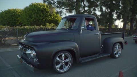 1993 Ford Taurus - This matte black 1956 Ford F-100 pickup truck features custom chrome wheels and a distinctive body style.