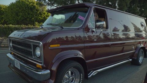 1993 Ford Taurus - This custom van features a distinctive body style and chrome accents, seen from the front three-quarter view.