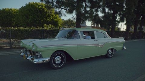 1993 Ford Taurus - Classic 1957 Ford Fairlane sedan in a two-tone green and white paint scheme.