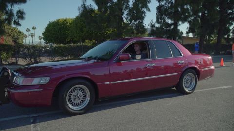 1993 Ford Taurus - This sedan, likely a 1995 model, is seen from the side with a push bar attached to the front.