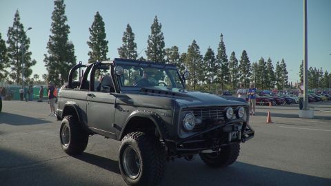 1993 Ford Taurus - Modified first-generation Ford Bronco parked outdoors at a car show.