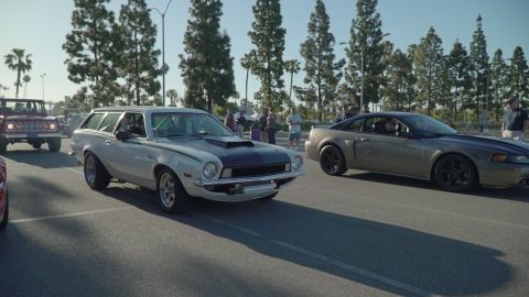 1993 Ford Taurus - A modified 1975 Ford Pinto wagon is shown at a car show with other vehicles.