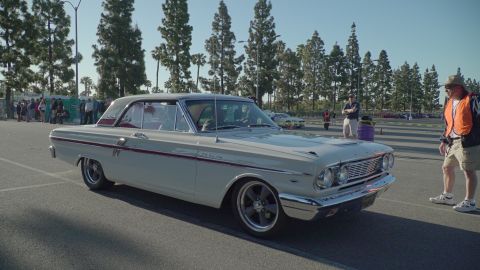 1993 Ford Taurus - A classic white Ford Galaxie is shown from the front-three-quarter view at an outdoor event.