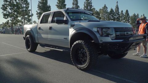 1993 Ford Taurus - This modified Ford F-150 Raptor features an aggressive front bumper and a roof-mounted LED light bar, indicating a model from the 2009-2014…