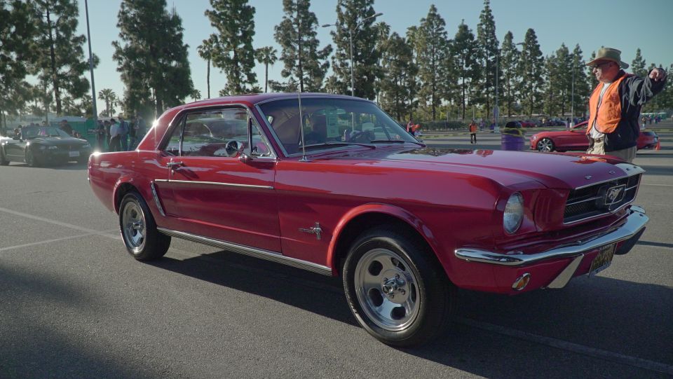 Red 1965 Ford Mustang coupe, 3/4 front view
