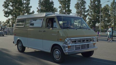 1993 Ford Taurus - This vintage Ford Econoline camper van features a two-tone paint scheme and a roof rack.