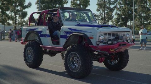 1993 Ford Taurus - This heavily modified Ford Bronco features a striking custom paint job and aggressive off-road stance.