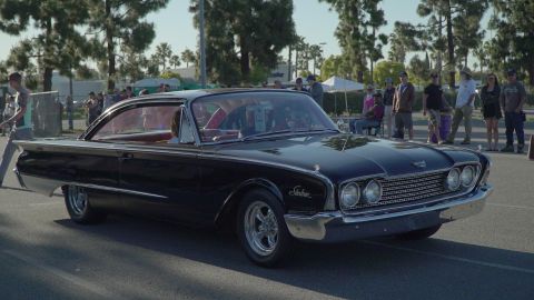 1993 Ford Taurus - This classic black 1960 Ford Starliner is on display at a car show.