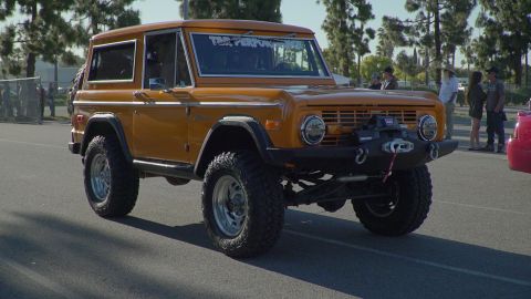 1993 Ford Taurus - This modified Ford Bronco is seen from a 3/4 front angle, equipped with off-road tires and a winch.