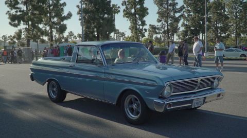 1993 Ford Taurus - A light blue 1963 Ford Falcon Ranchero pickup truck is seen from the front-three-quarter angle at an outdoor car show.