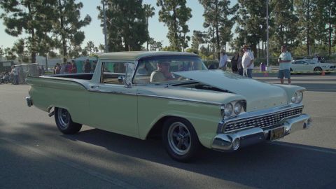 1993 Ford Taurus - This two-tone 1959 Ford Ranchero has its hood open, revealing the engine bay.