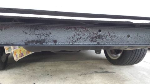 1976 Ford Ranchero - A close-up view of a vehicle's rear bumper shows signs of wear and tear.