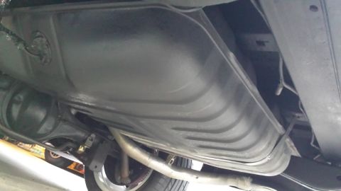 1976 Ford Ranchero - A close-up view of a vehicle's undercarriage, focusing on a specific part.