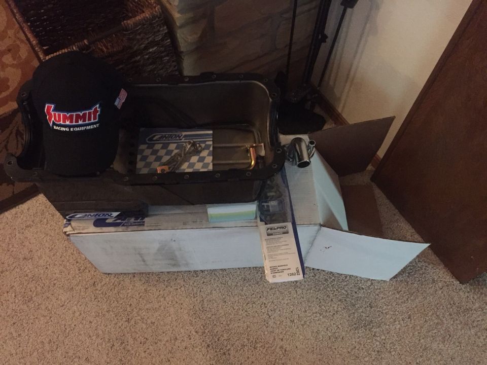 Summit Racing hat and Canton oil pan on a white box.