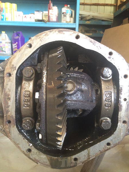 1981 Ford Bronco - This is a close-up view of an open differential housing with visible gears and bearing caps. The housing is rusty and appears to be covered…